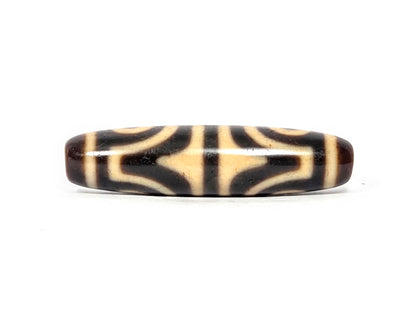 Second tiger tooth face of antique Tibetan dzi bead showing angular pointed tiger tooth motif, At-082525-4ETT