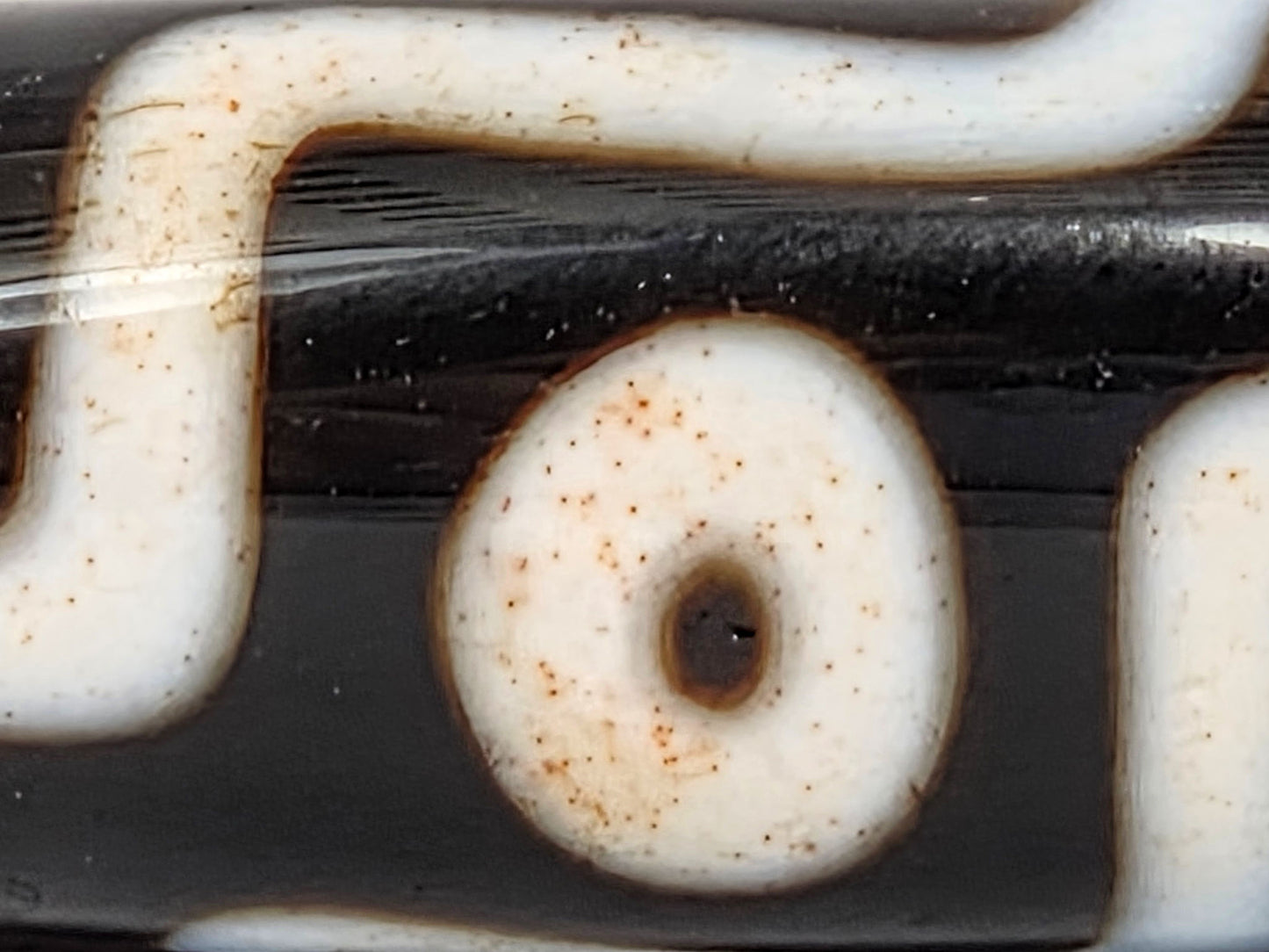 At-060326-9E5 macro eye ring dense rust-orange cinnabar dots white zone pitch-black dzi unretouched
