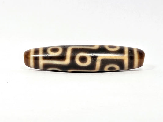 Antique Tibetan Nine Eye dzi bead face A, clean cream eye network on warm medium-brown agate, At-083025-9E3