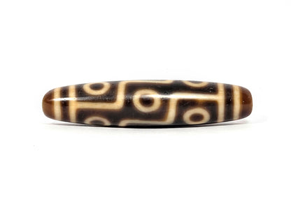 Antique Tibetan Nine Eye dzi bead face C showing nine-eye network on warm brown agate body, At-083025-9E3