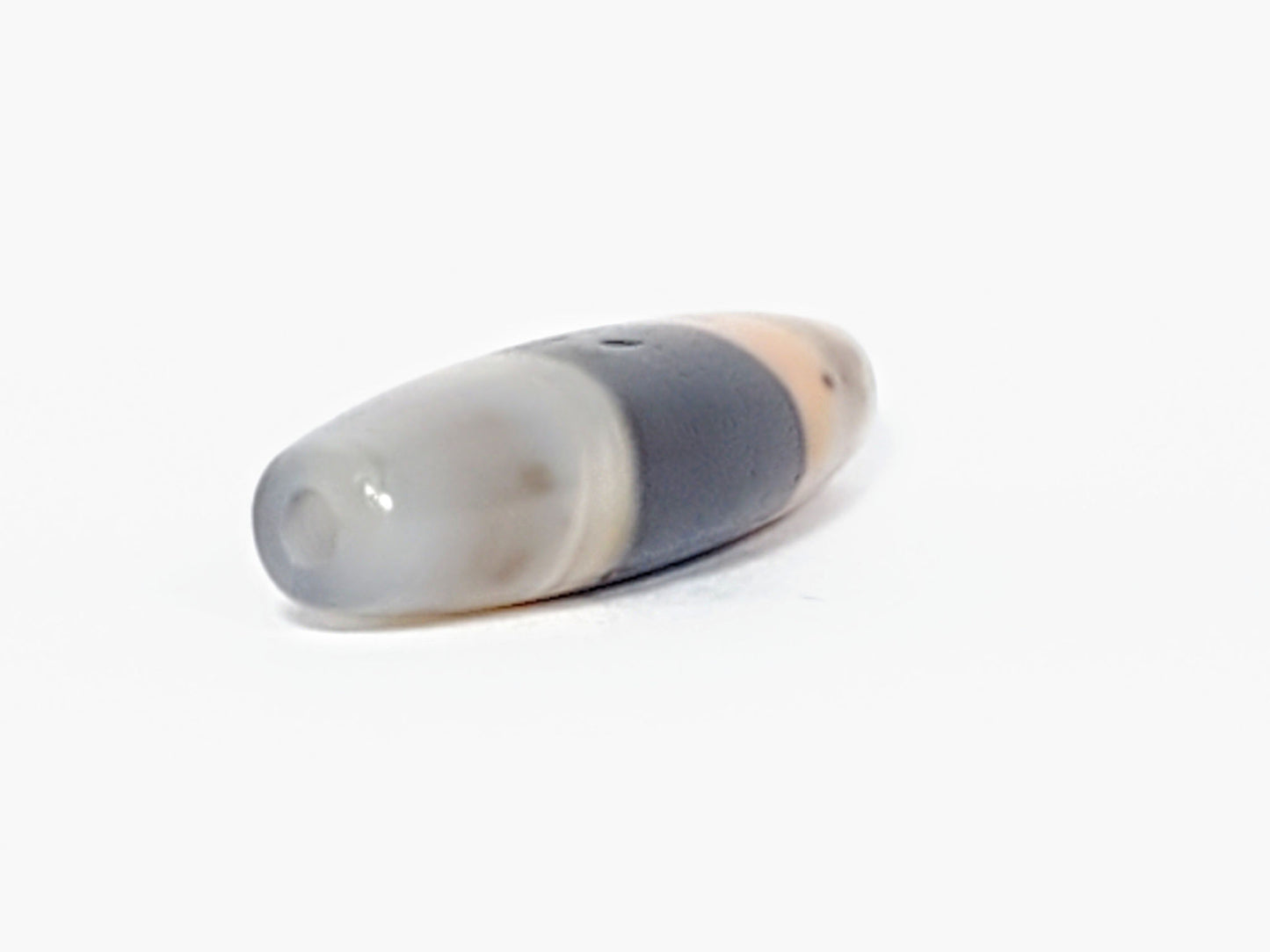 At-061526-1SBow, drill hole end cap face, milky grey-white agate, matte-satin finish, pinholes visible, unretouched