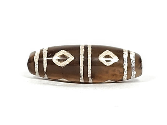 Antique six eye dzi — front face, two open diamond eyes on warm brown agate ground, raised textured stripe bars, At-0426-6E
