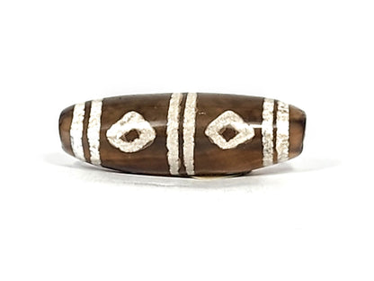 Antique six eye dzi — third face, two squarish diamond eyes, heavily weathered white etching on warm brown ground, At-0426-6E