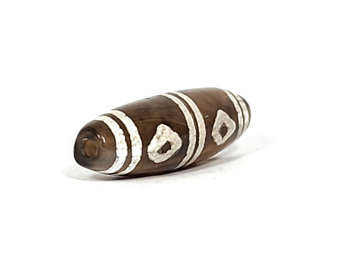 Antique six eye dzi — angled end, drill hole at warm brown-grey rounded tip, two diamond eyes on body, At-0426-6E