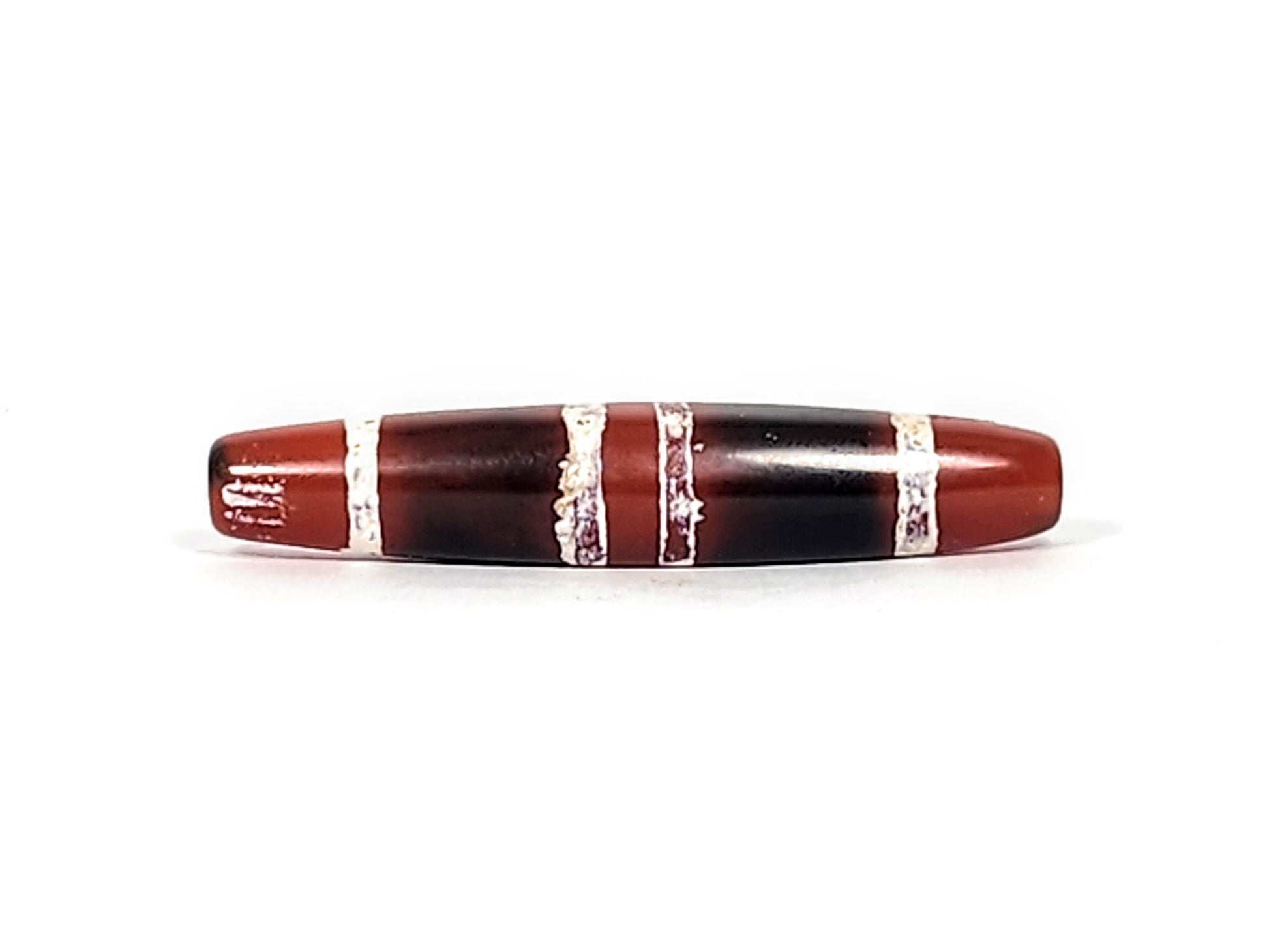 At-122324-3TS antique 3-stripe carnelian dzi, third face, mineral deposits at drill rim, etched stripe detail, unretouched