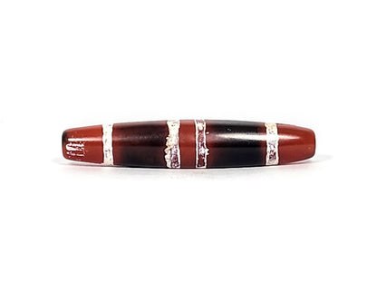 At-122324-3TS antique 3-stripe carnelian dzi, third face, mineral deposits at drill rim, etched stripe detail, unretouched