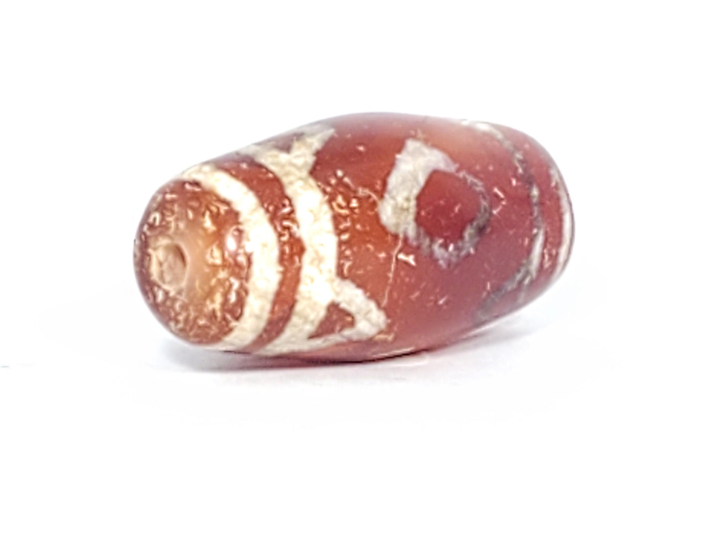 At-053126-3DETT antique carnelian dzi, left end cap drill hole, cream-white mineral band, terracotta body, unretouched