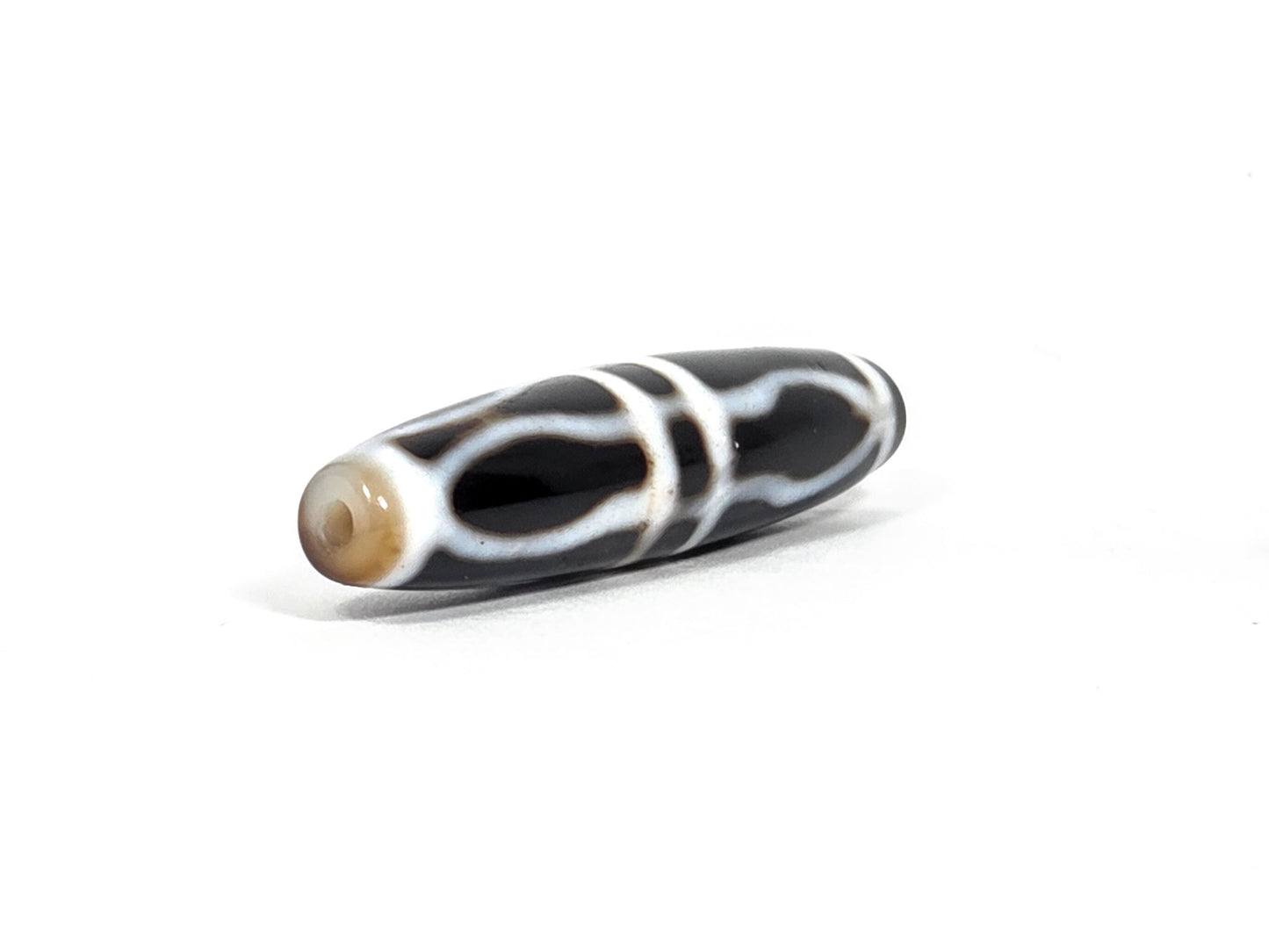 At-090226-3VJBS antique triple vajra dzi drill end view two warm medium brown tip agate unretouched