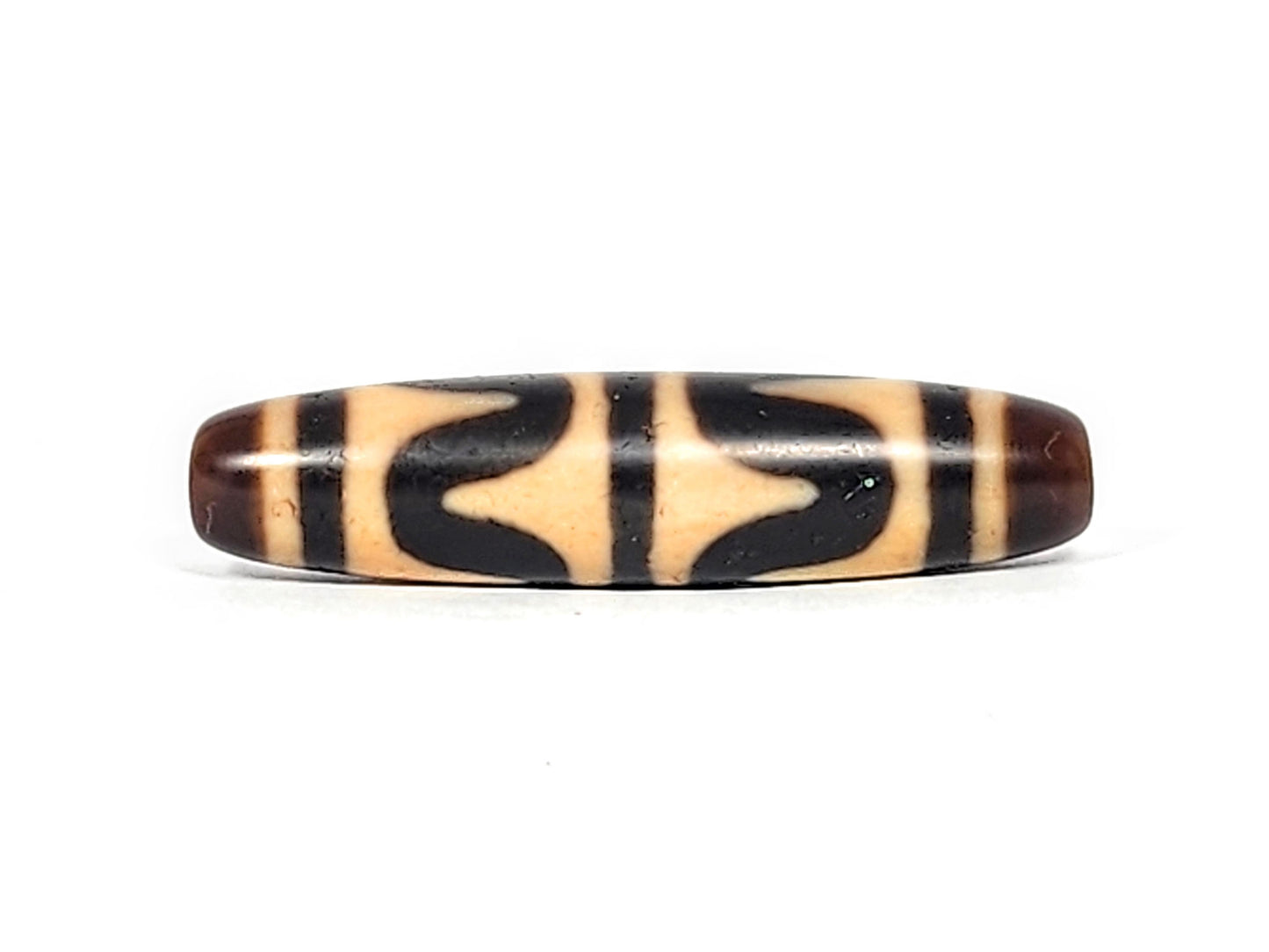 Reverse side of antique Double Wave dzi bead showing cupped arch wave pair on warm brown agate, At-052526-DW3