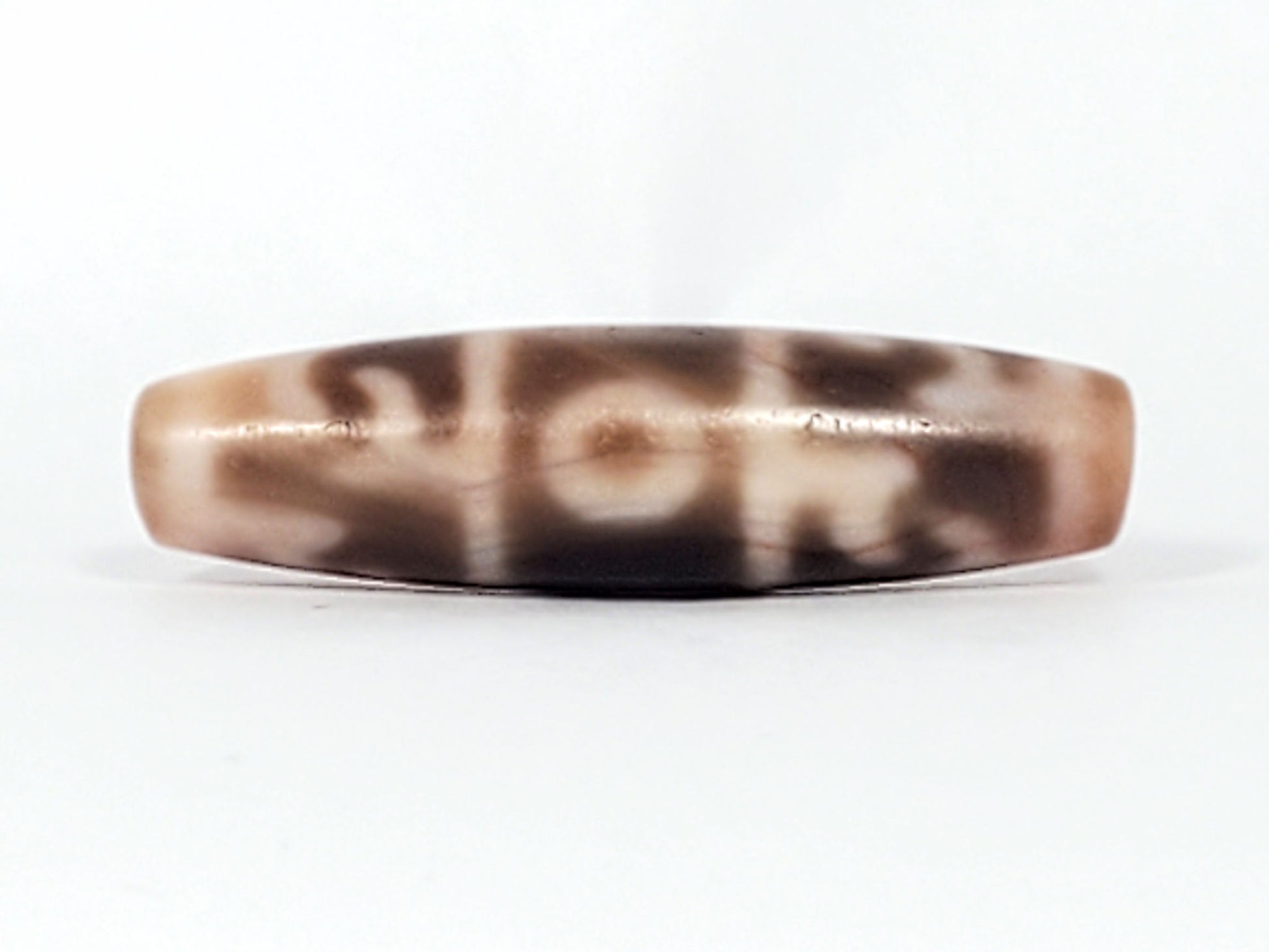 At-060326-GRRP, Face B, paraphernalia motif and central eye, cream-dominant flat disc-barrel, unretouched