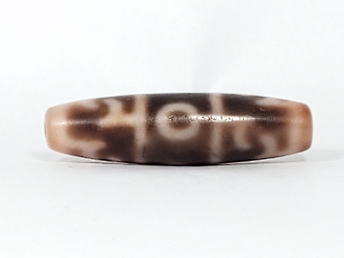 At-060326-GRRP, Face C showing full paraphernalia composition with angular forms and eye, warm cream agate, unretouched