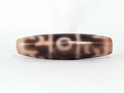 At-060326-GRRP, Face C showing full paraphernalia composition with angular forms and eye, warm cream agate, unretouched