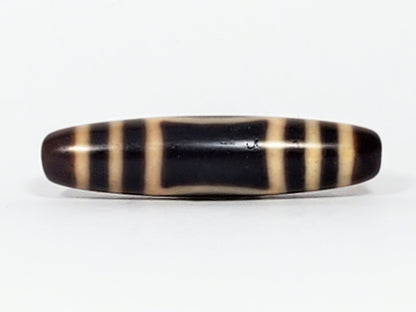 Antique Tibetan Heaven Earth dzi bead face C showing rectangular window gate form on dark agate, At-082324-HE3