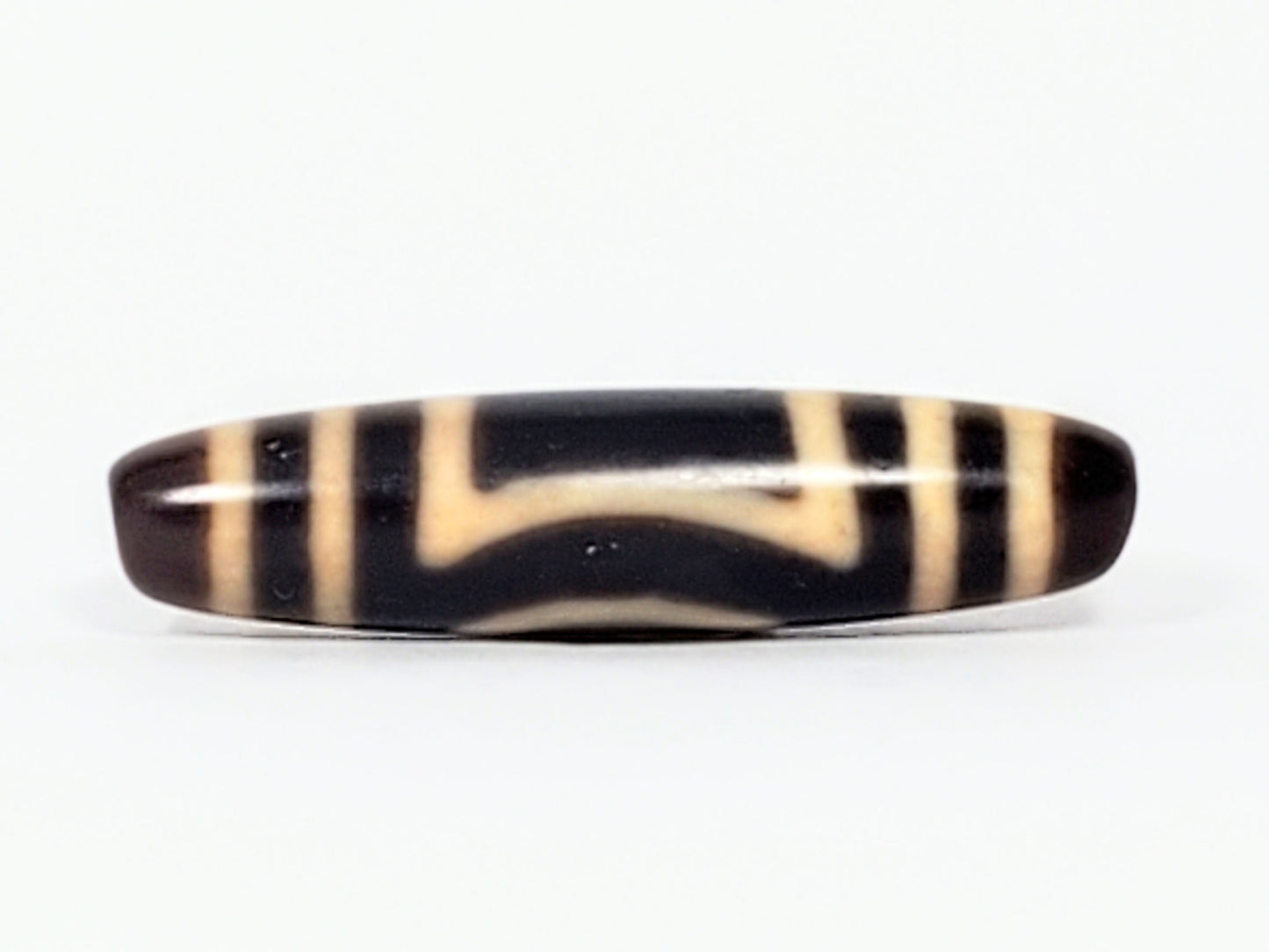 Antique Heaven Earth dzi bead face D showing angular T-bracket cream motif on near-black agate, At-082324-HE3