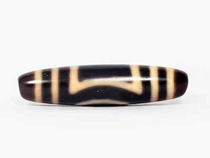 Antique Heaven Earth dzi bead face D showing angular T-bracket cream motif on near-black agate, At-082324-HE3