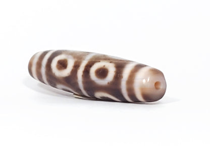At-081624-8E end B sandy-beige cap three-quarter view open-ring eyes 48.9mm dzi unretouched