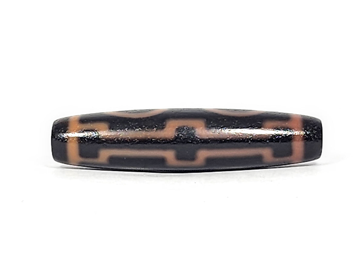 Third angle of antique Four Eye dzi At-012325-4E, amber eye rings and connecting stripes on dark brown agate, full torpedo body profile, 51.9mm × 12.2mm, unretouched photography