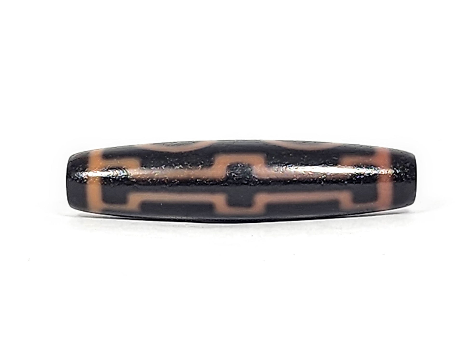Third angle of antique Four Eye dzi At-012325-4E, amber eye rings and connecting stripes on dark brown agate, full torpedo body profile, 51.9mm × 12.2mm, unretouched photography