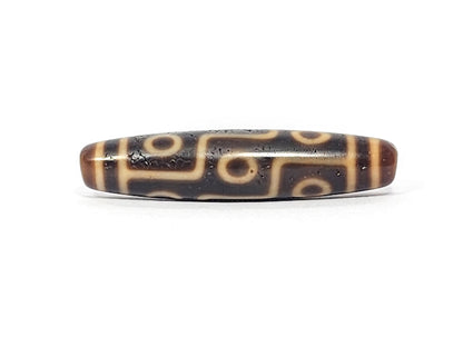Antique Tibetan Nine Eye dzi bead face C with staggered eyes and pronounced weathered surface texture, At-051525-9E2