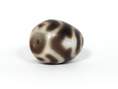 Ac-011824-TVR ancient round treasure vase dzi, opposite end, cream-dominant face, unretouched