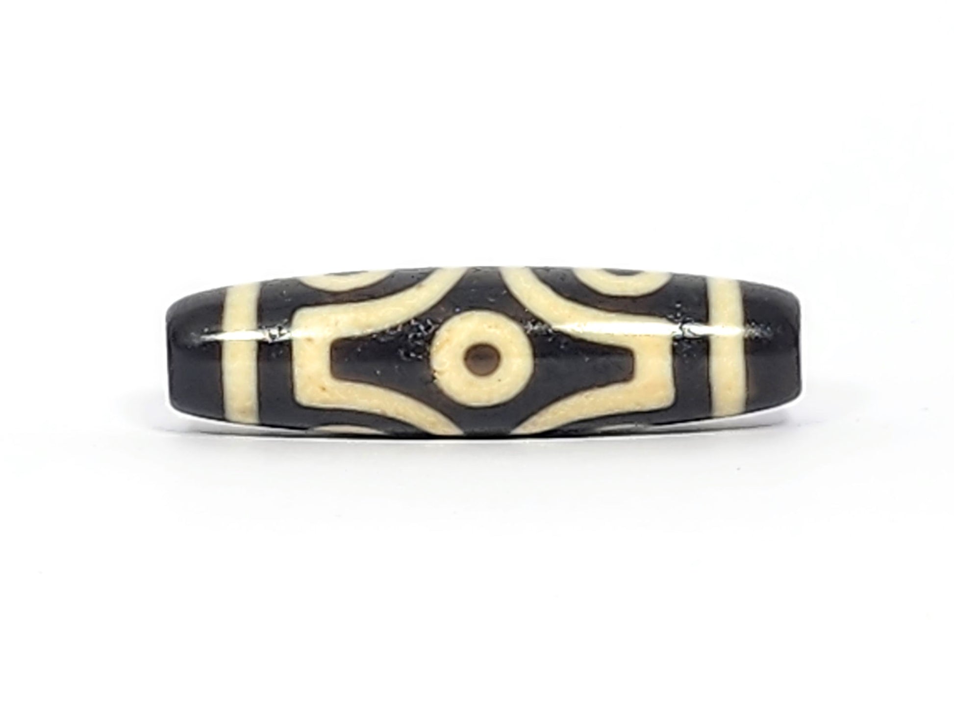  Face B of antique six eye dzi At-042925-6E2, single concentric-ring eye within diamond star frame on pitch-black agate, bright white cream, 41.4mm, unretouched photography