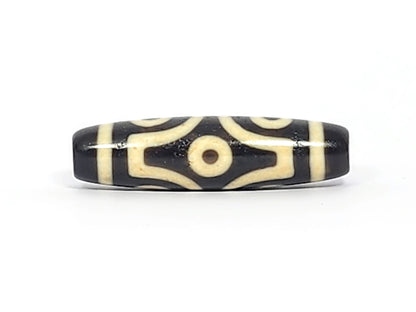  Face B of antique six eye dzi At-042925-6E2, single concentric-ring eye within diamond star frame on pitch-black agate, bright white cream, 41.4mm, unretouched photography