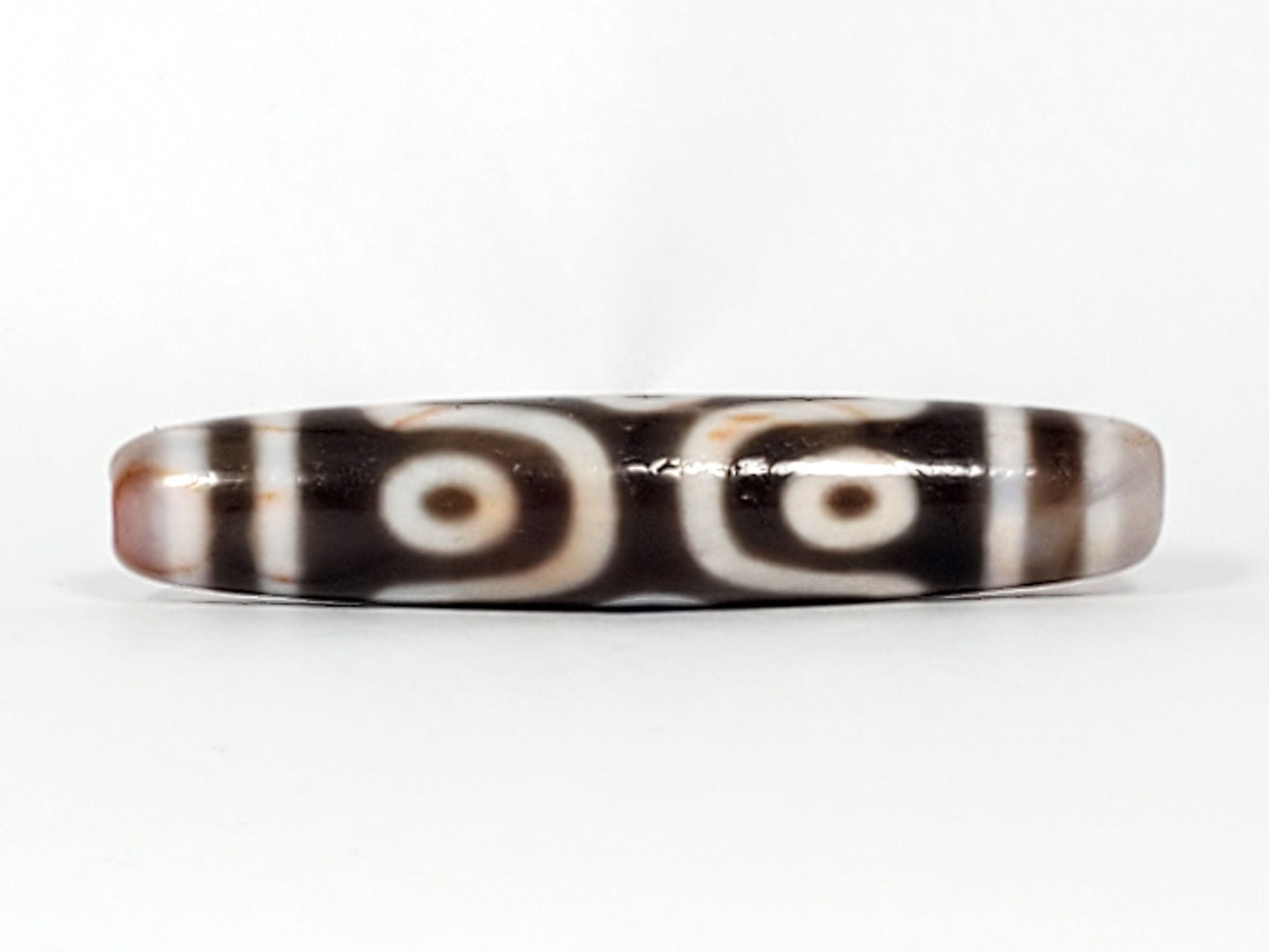 At-082824-6EBS2 face B two rounded open-ring eyes deep dark warm-brown sandy-cream end cap dzi unretouched