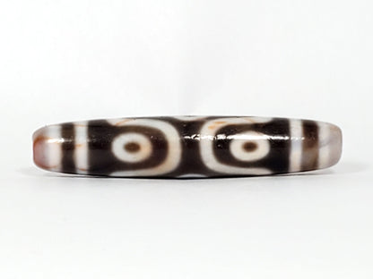 At-082824-6EBS2 face B two rounded open-ring eyes deep dark warm-brown sandy-cream end cap dzi unretouched