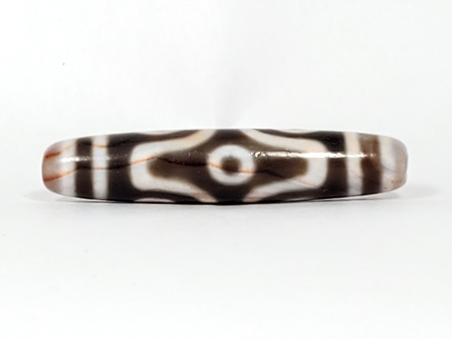 At-082824-6EBS2 face C angular eye frame radiating white lines deep dark warm-brown dzi unretouched