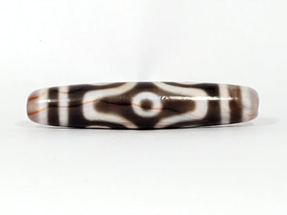 At-082824-6EBS2 face C angular eye frame radiating white lines deep dark warm-brown dzi unretouched