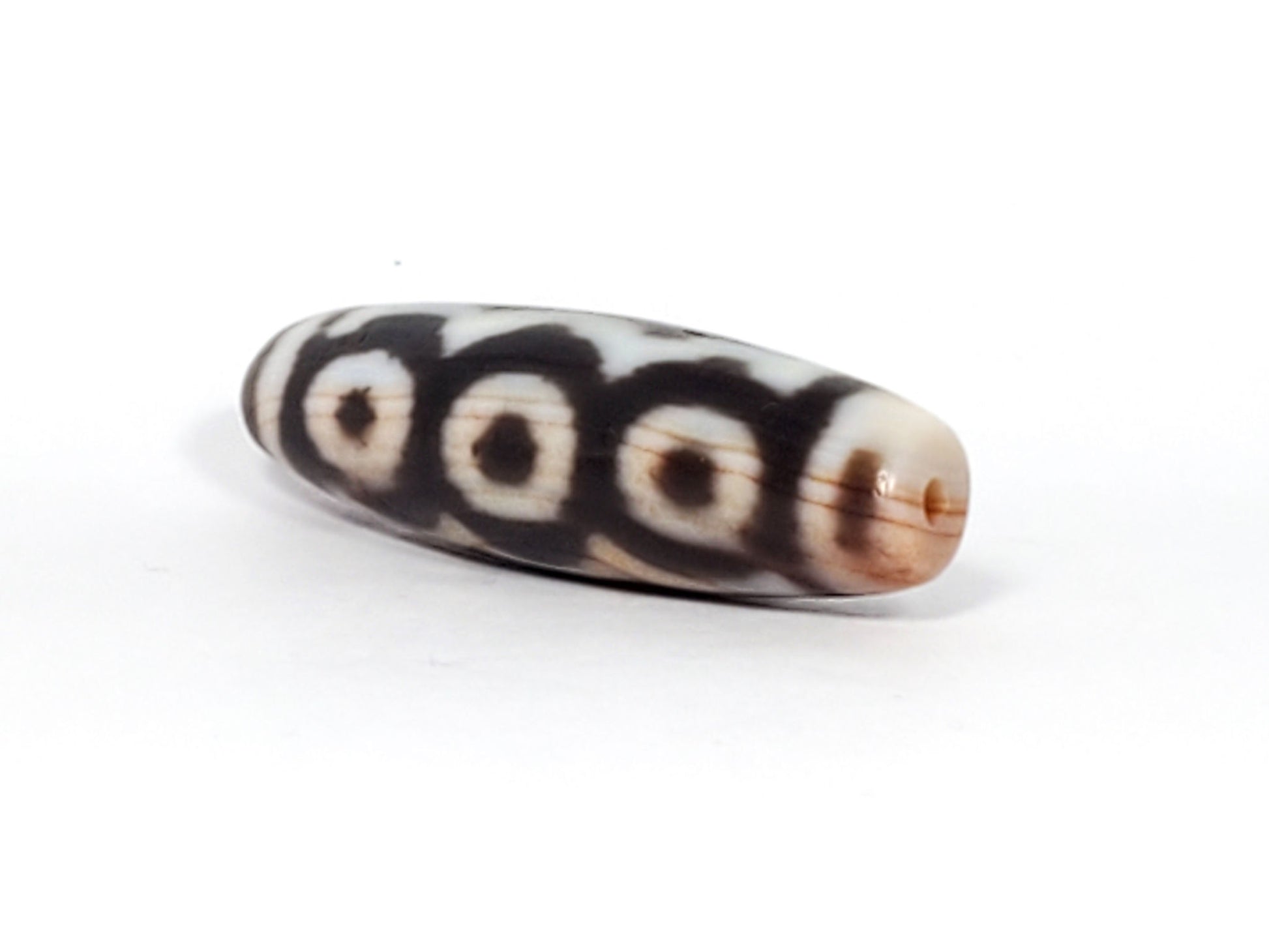 At-112623-6EBS end B warm russet-brown cap three-quarter view 47.1mm spindle dzi unretouched
