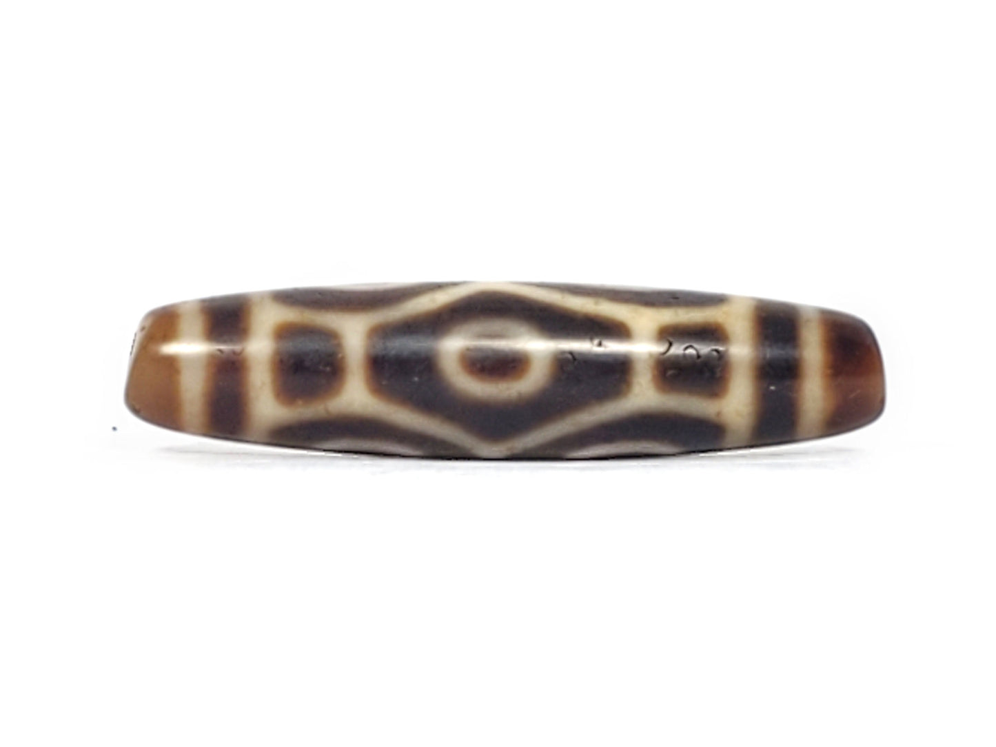 Antique Six Eye Naga dzi bead face B showing hexagonal dragon body scale form with single eye centre, At-092524-6EN