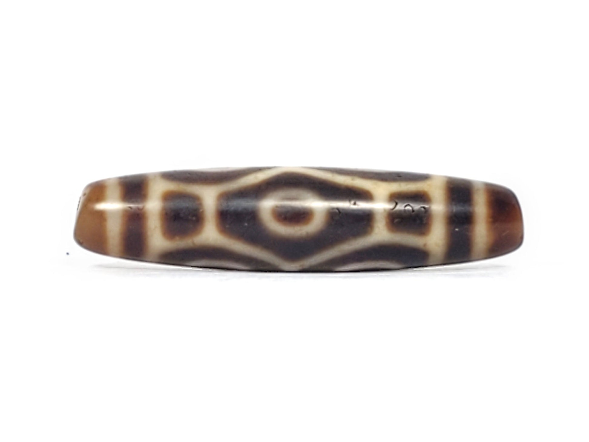 Antique Six Eye Naga dzi bead face B showing hexagonal dragon body scale form with single eye centre, At-092524-6EN