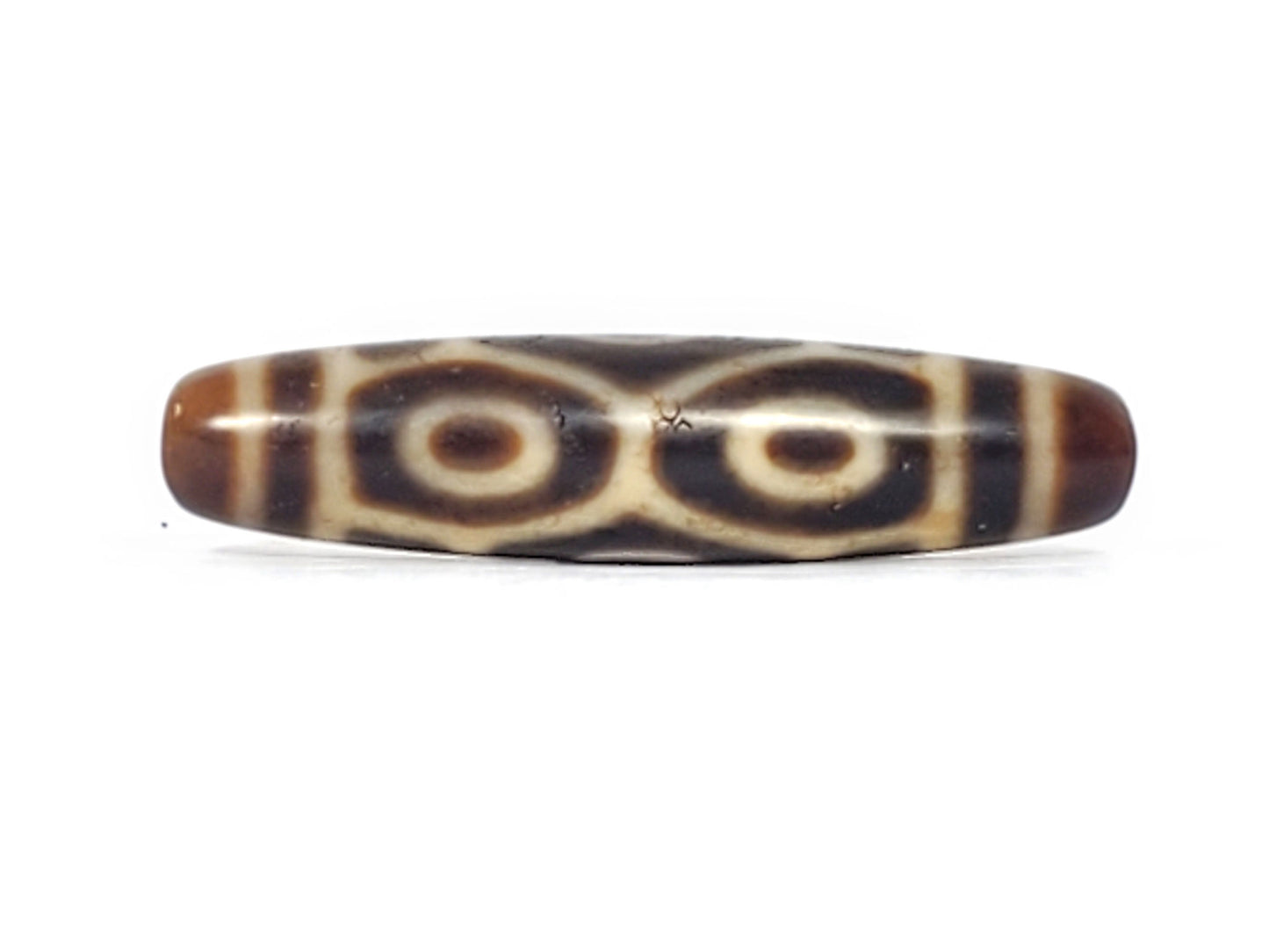Antique Dragon Eye Naga dzi bead face C showing paired concentric-ring eyes on warm dark brown agate, At-092524-6E