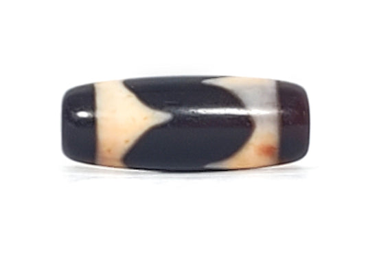 Antique Tibetan Tasso dzi bead At-092924-TaBS2, front face, opposing cream tooth-forms on pitch-black agate, chevron composition, compact barrel 28.7mm × 11.2mm, unretouched