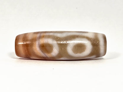 At-072326-3EVBS antique three eye variant dzi face C two oval eye rings warm brown ground unretouched