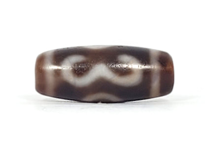 Third angle of antique Double Bat Two Eye dzi At-053026-DB2E, stylised bat wing silhouette with integrated two-eye motif, deep dark brown agate, 28.8mm × 12.0mm, unretouched