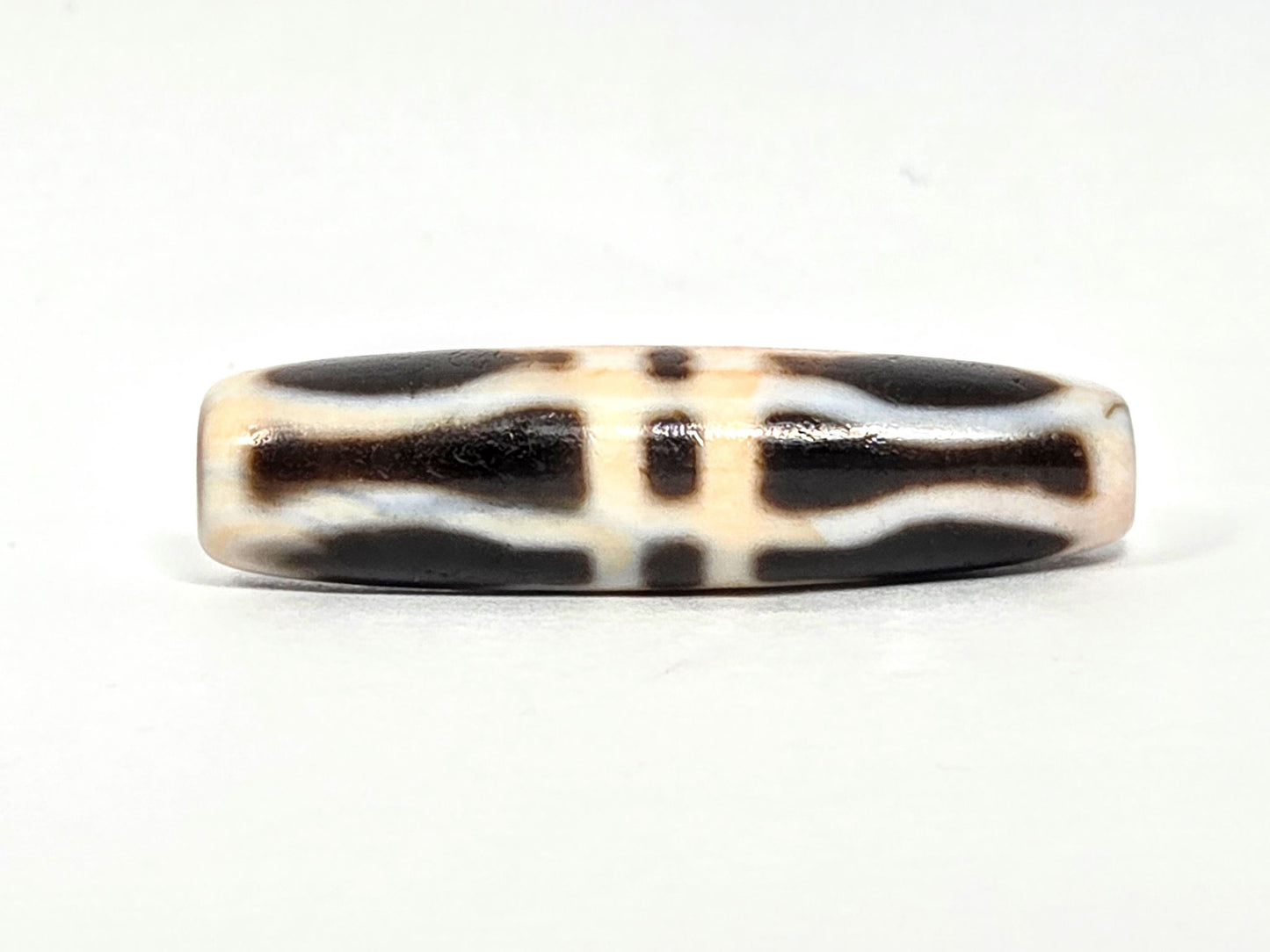 At-070626-3VjBS rotated face 2, triple vajra dzi, very dark brown upper register, cream-white bands, unretouched