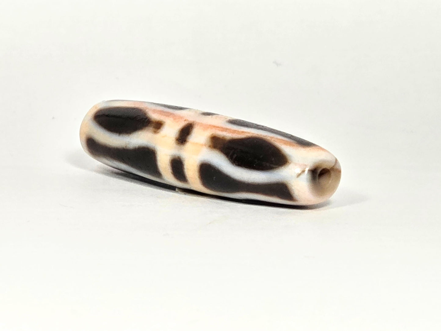At-070626-3VjBS angled drill-end, triple vajra dzi, cream-white agate end cap, small centred drill hole, unretouched