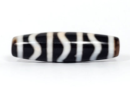 Reverse side of antique Tibetan Wave Stripe dzi bead, bold black and cream agate banding, At-052526-WS