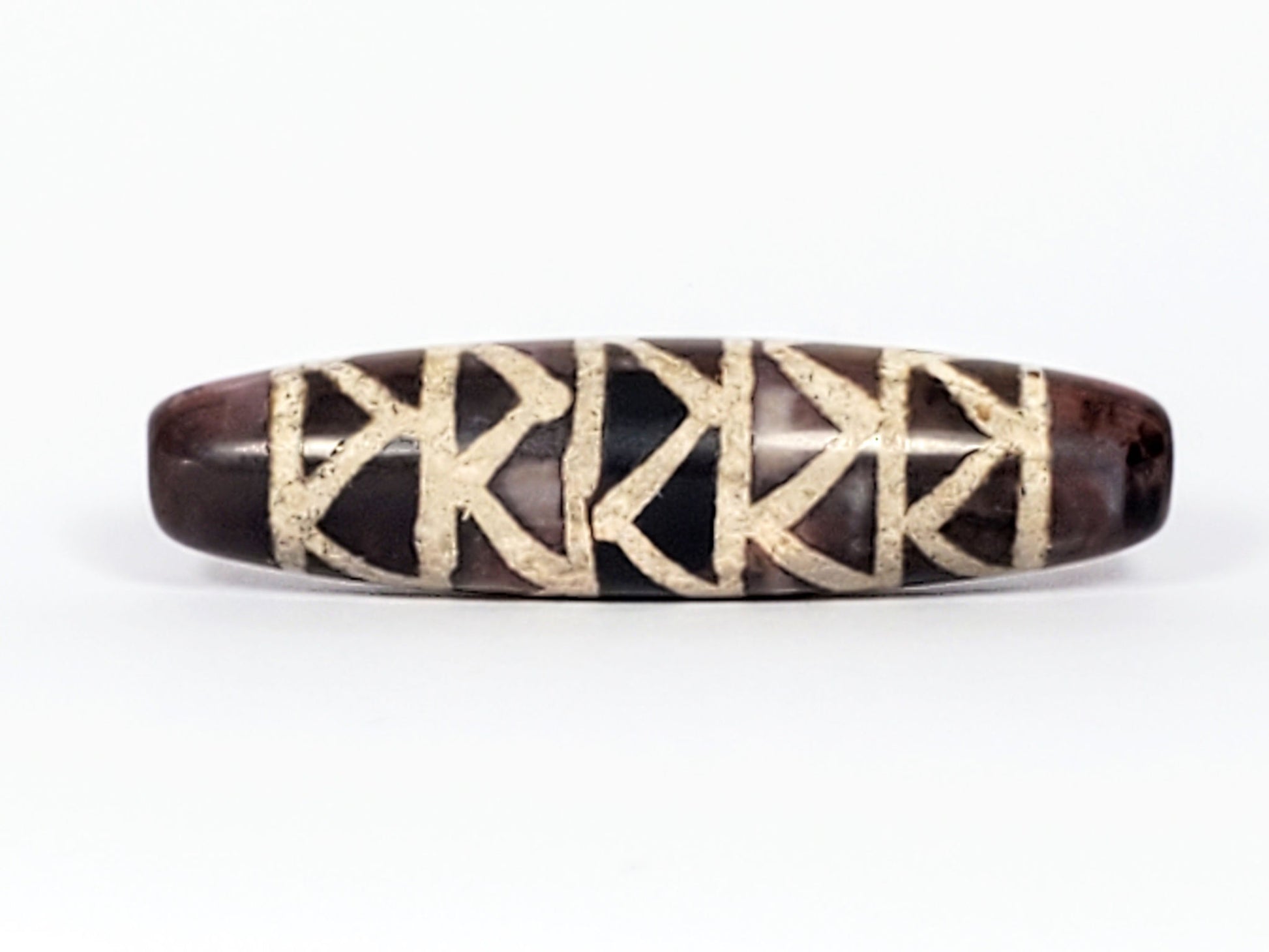 At-040524-TTStr antique carnelian dzi, 49.8×12.7mm, Face A, tiger tooth pairs + stripe dividers, tri-tone, unretouched
