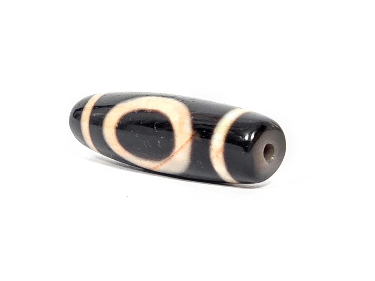 At-072326-1ESWBS antique one eye yungdrung dzi drill end A pitch-black tip small clean drill hole unretouched