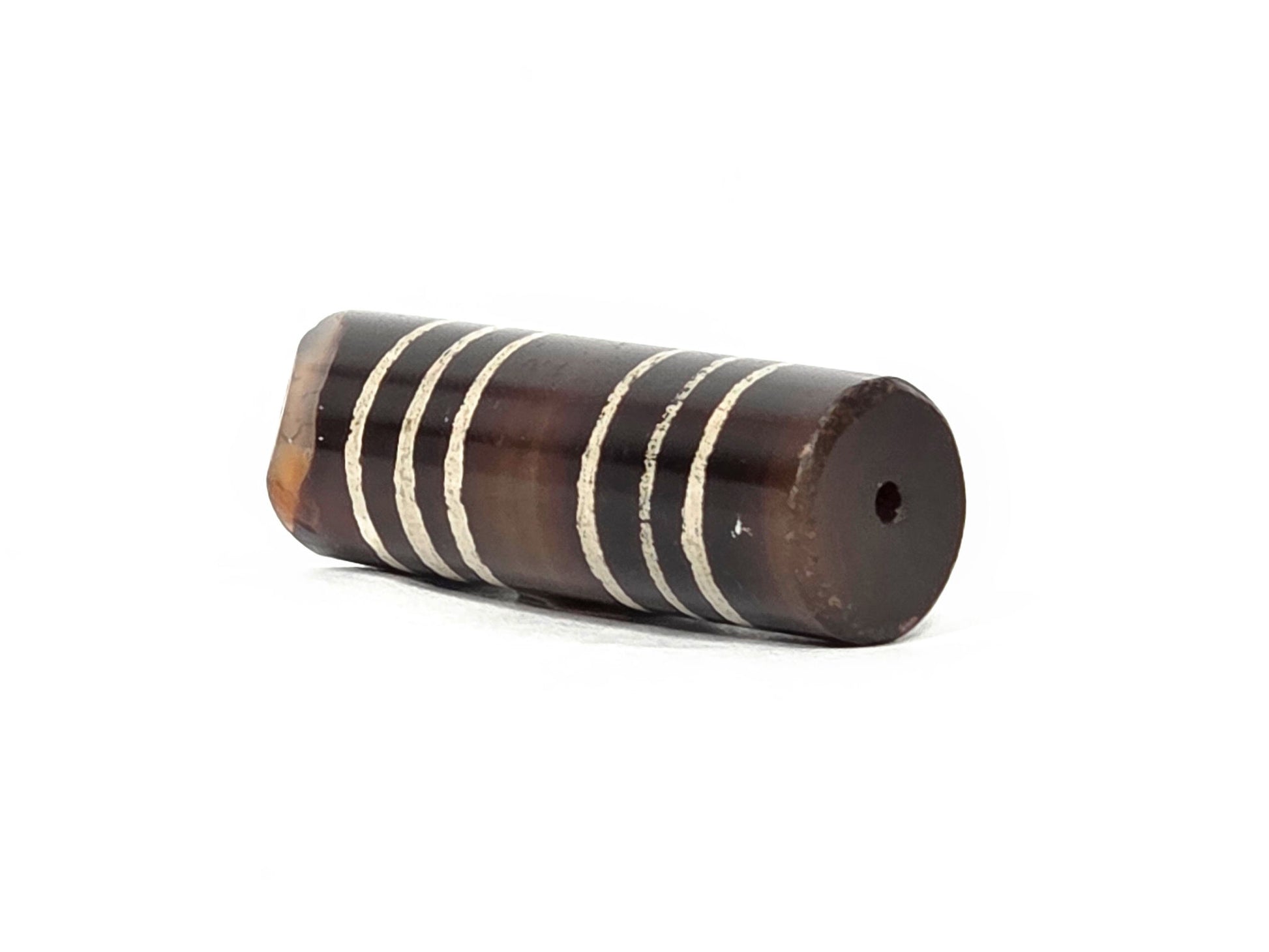 Ac-062226-6Str, intact end showing centred drill hole, deep warm dark brown, six-stripe agate dzi, unretouched