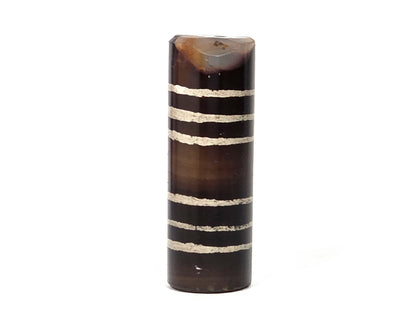 Ac-062226-6Str, reverse face view, six stripe agate dzi, warm dark brown, chip at top rim visible, unretouched