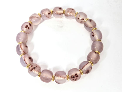 N-030526-CB2 chalcedony bracelet overhead, round mauve-rose beads, gold rondelle spacers, cinnabar inclusions, unretouched