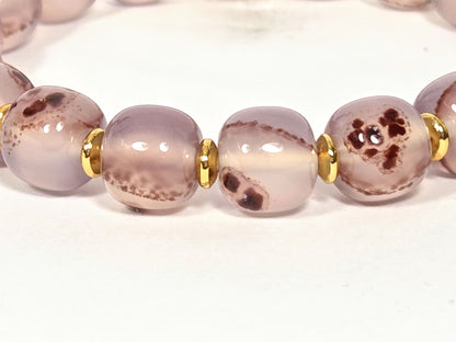 N-030526-CB2 close-up, dark brown-red cinnabar cluster mass in dusty mauve-rose chalcedony, gold spacers, unretouched