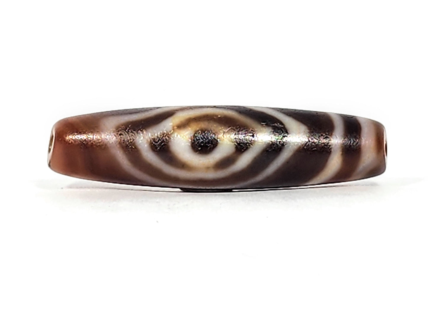 Antique eye-in-eye heaven gate dzi — front face, Eye-in-Eye motif centred, concentric rings, dark pupil, At-0426-EIE