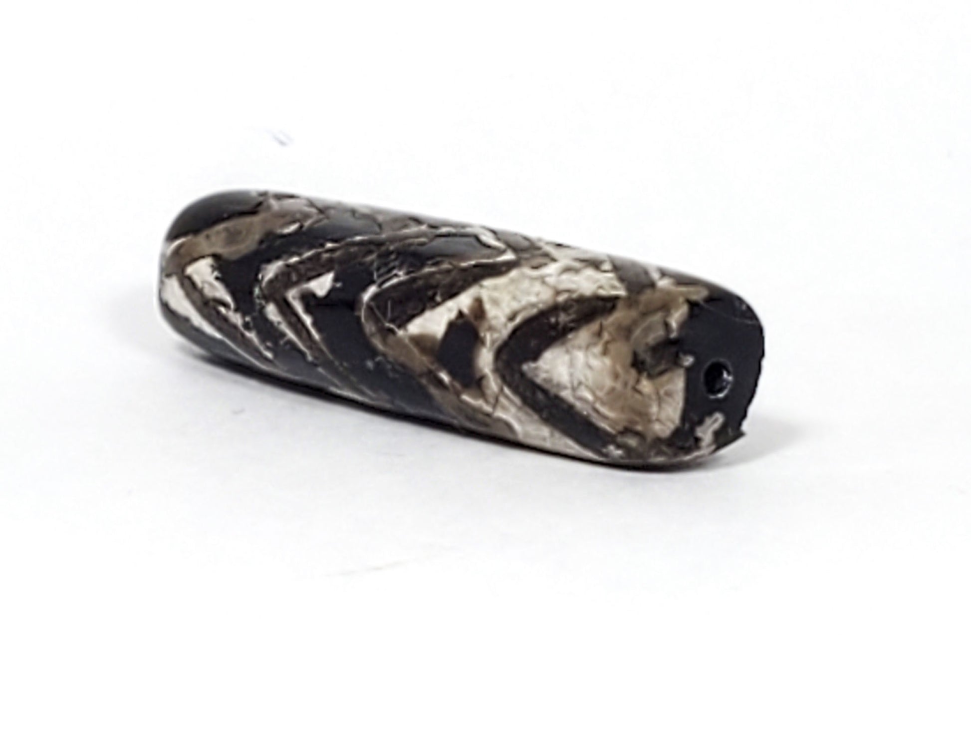 Ac-071026-4TT ancient tiger tooth dzi bead angled view drill end calcification wrap small hole unretouched