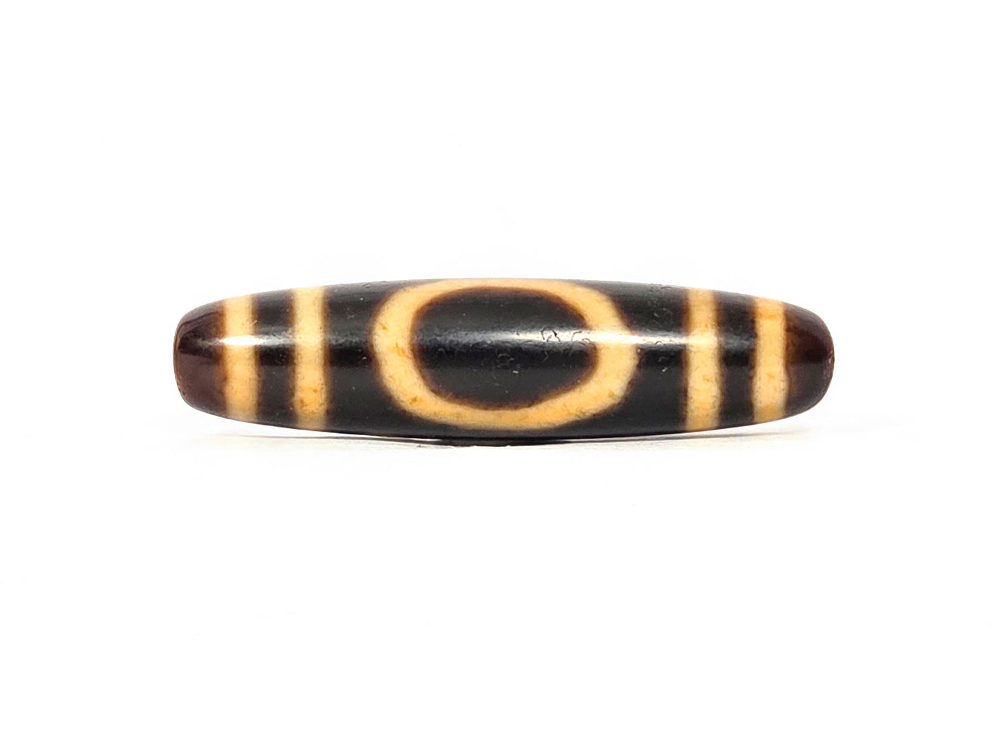Antique heaven earth dzi — front face, oval heaven gate ring in golden amber on jet-black ground, bracket bars, At-0426-HE