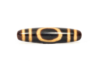 Antique heaven earth dzi — front face, oval heaven gate ring in golden amber on jet-black ground, bracket bars, At-0426-HE